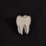 Brooch: T 1